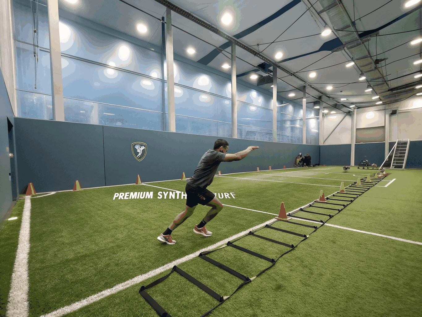 Performance training facility equipped with resilient synthetic turf speed lanes in Plano