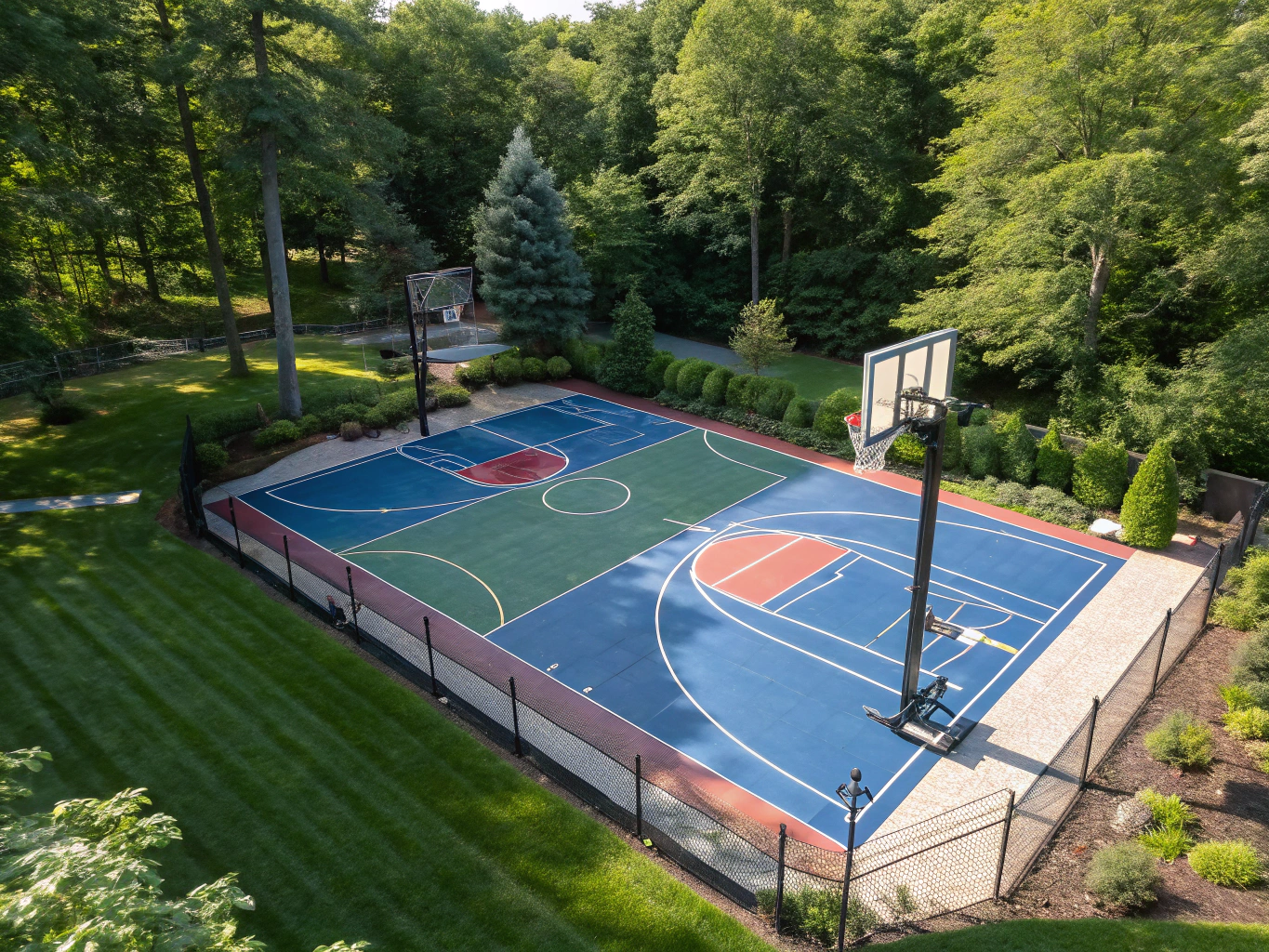 Custom backyard multi-sport court with lush surrounding artificial grass in Lucas