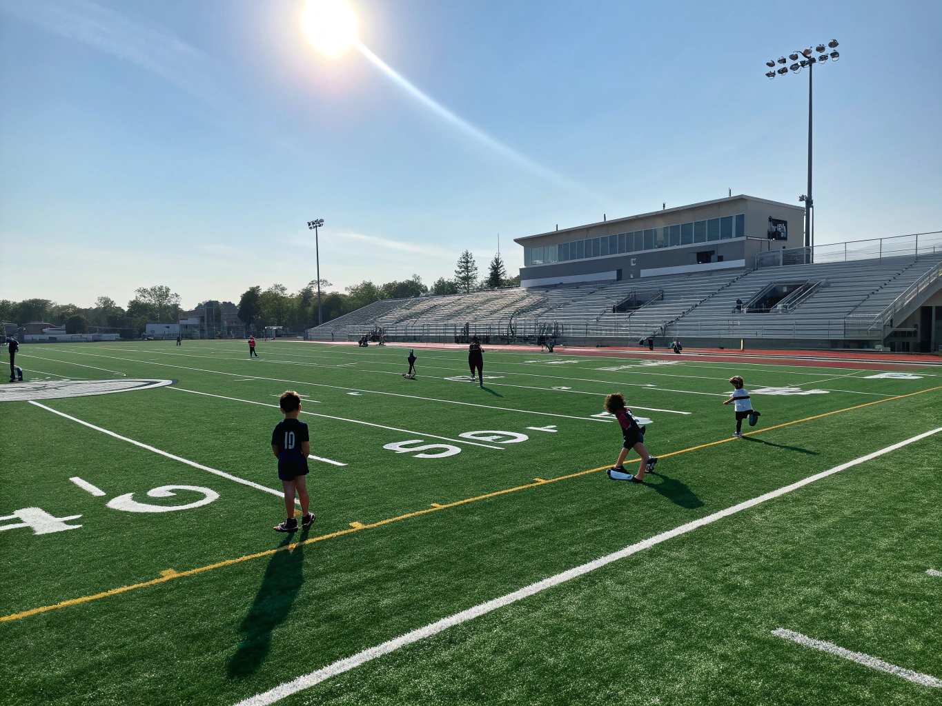 School athletic complex with durable green artificial turf training field in Murphy
