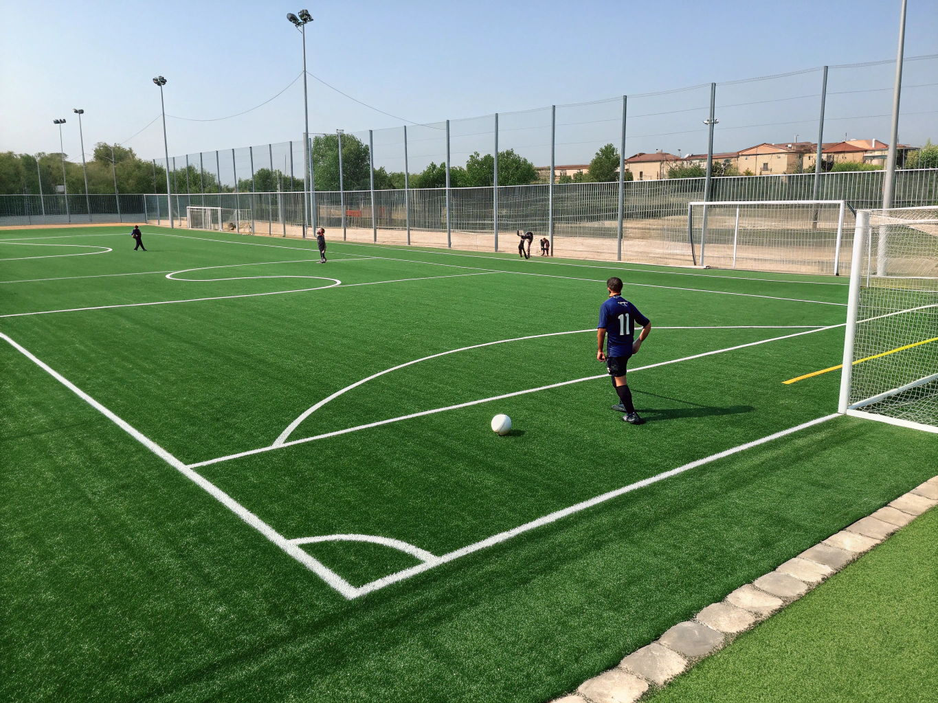 Professional synthetic turf athletic soccer field with crisp regulation boundary lines